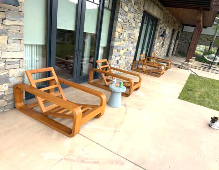 Outdoor wood furniture after refinishing with a warm honey finish