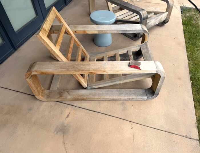 Weathered outdoor wood furniture before refinishing