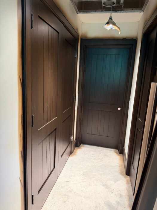 Interior doors painted in a deep dark brown finish